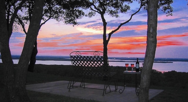 patio terrace at dusk with a water view