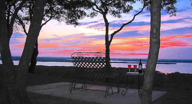 view of patio featuring a water view