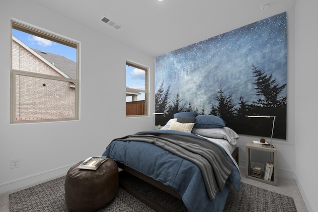 bedroom featuring baseboards, visible vents, and carpet floors