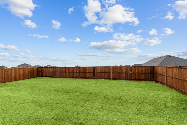 view of yard featuring a fenced backyard