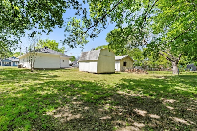 view of yard with a storage shed and an outdoor structure