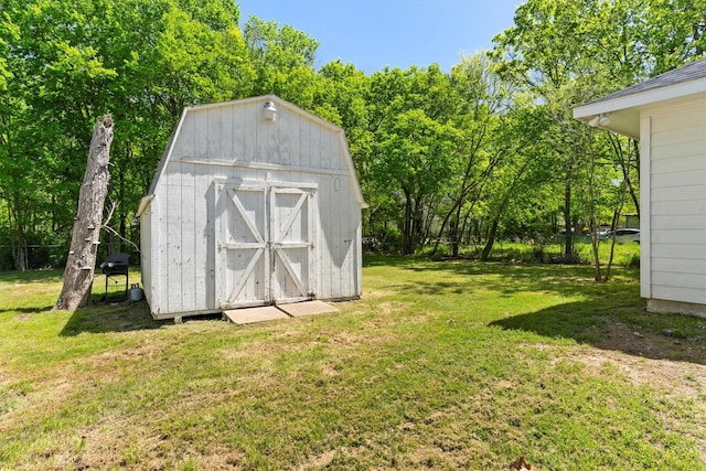 view of shed featuring fence