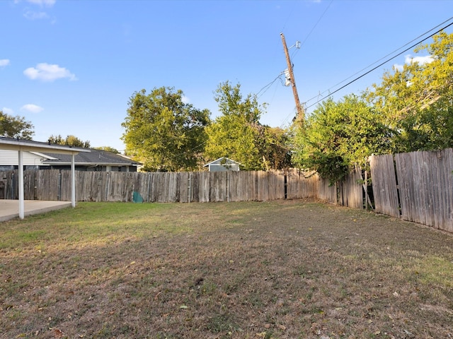 view of yard featuring a patio and a fenced backyard