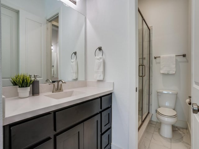 full bath featuring vanity, toilet, marble finish floor, and a stall shower