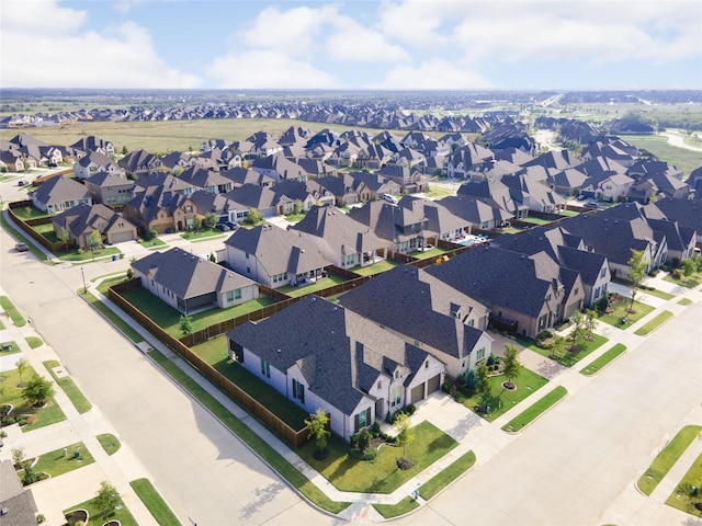 birds eye view of property with a residential view