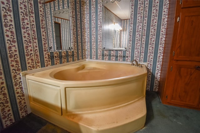 full bath featuring a bath and wallpapered walls