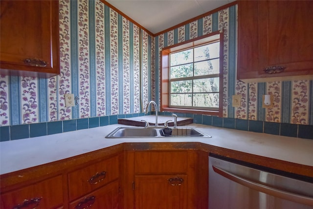 kitchen featuring wallpapered walls, dishwasher, light countertops, brown cabinetry, and a sink