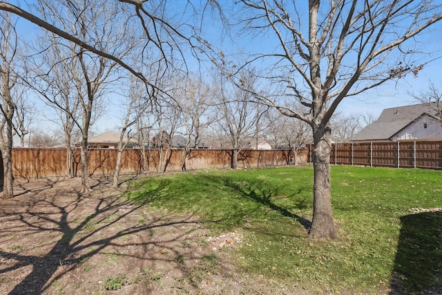 view of yard featuring a fenced backyard