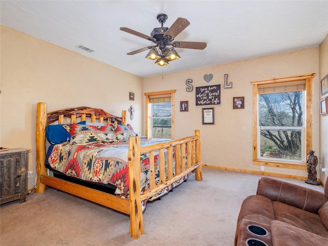 bedroom with visible vents, ceiling fan, baseboards, and carpet floors