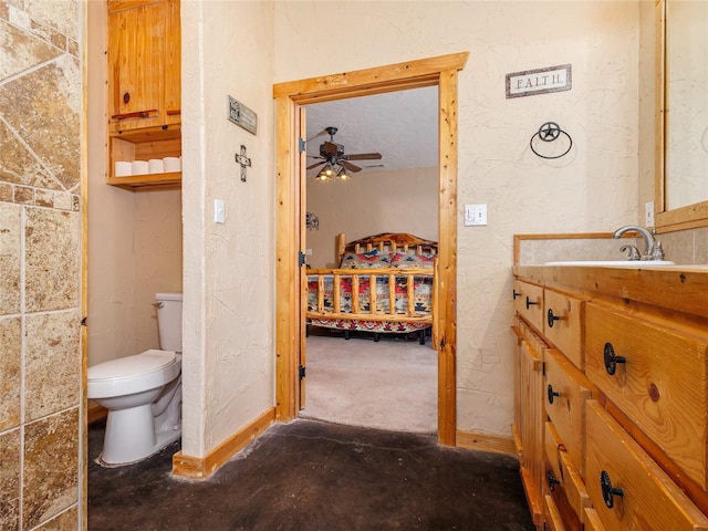 bathroom with toilet, a ceiling fan, vanity, unfinished concrete floors, and a textured wall