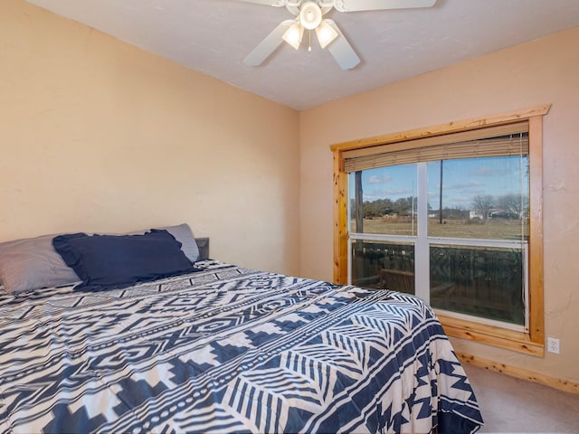 carpeted bedroom featuring a ceiling fan