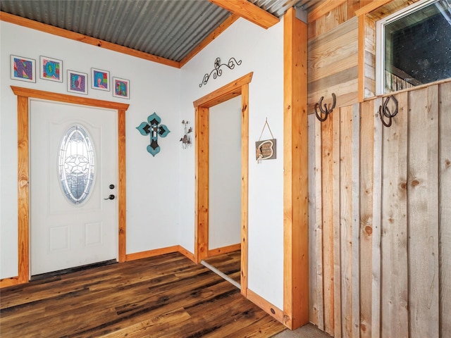 entryway with wood finished floors and baseboards