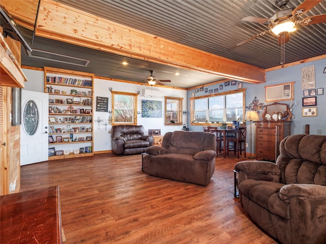 living room featuring a ceiling fan, beamed ceiling, wood finished floors, and a wall mounted AC