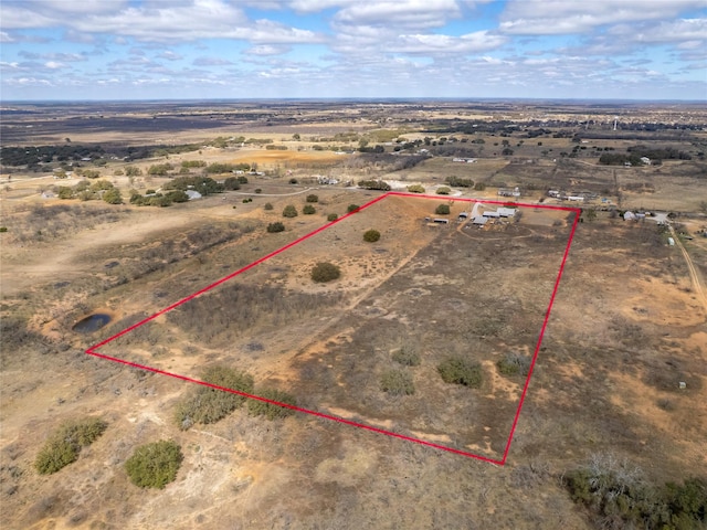 drone / aerial view with a rural view and a desert view