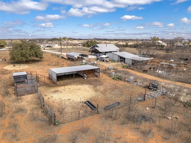 birds eye view of property featuring a rural view