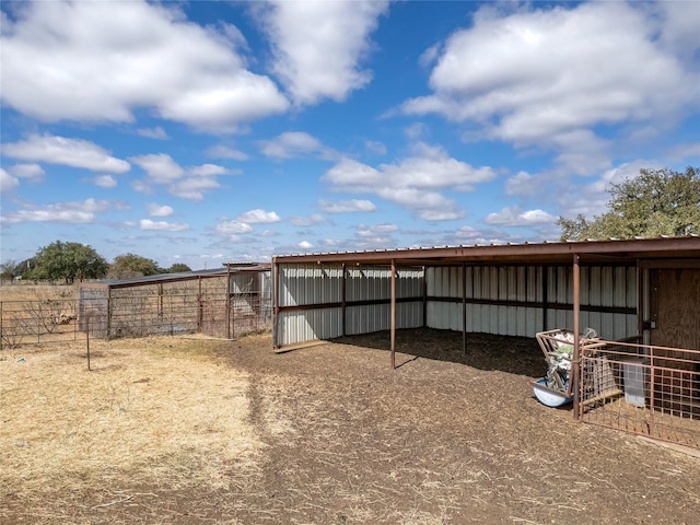 view of yard with an outdoor structure and a pole building