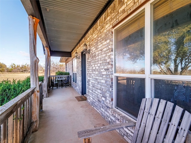 balcony featuring a porch