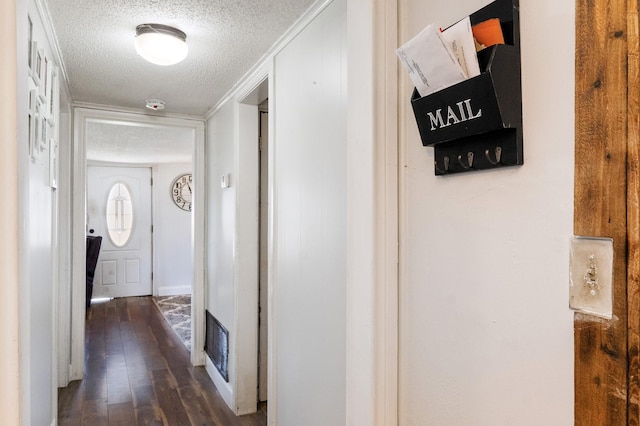 1719 E Bankhead Dr, Weatherford, TX 76086 - corridor with a textured ceiling and dark wood finished floors