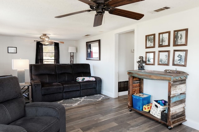 1719 E Bankhead Dr, Weatherford, TX 76086 - living area with ceiling fan, wood finished floors, baseboards, and ornamental molding