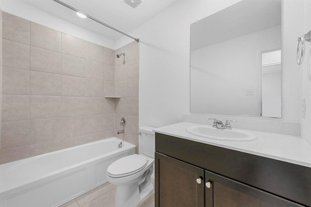 bathroom featuring vanity, visible vents, shower / washtub combination, tile patterned floors, and toilet