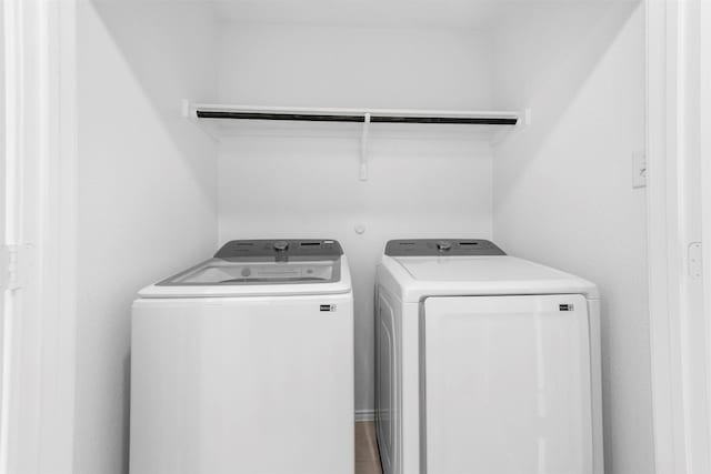 washroom featuring laundry area and independent washer and dryer