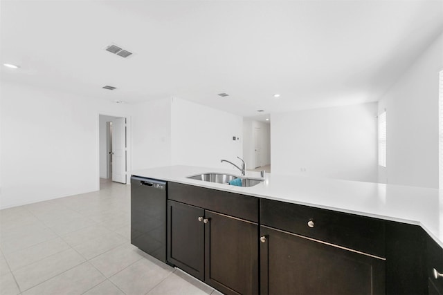 kitchen featuring visible vents, a sink, black dishwasher, light tile patterned flooring, and light countertops