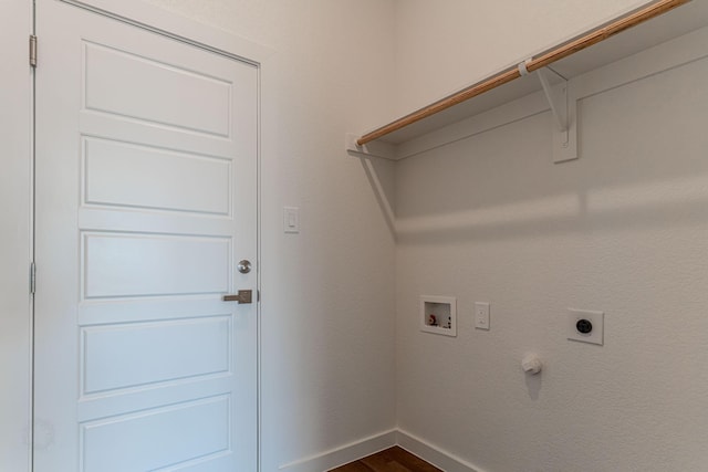 clothes washing area featuring hookup for a washing machine, baseboards, laundry area, dark wood-style flooring, and electric dryer hookup