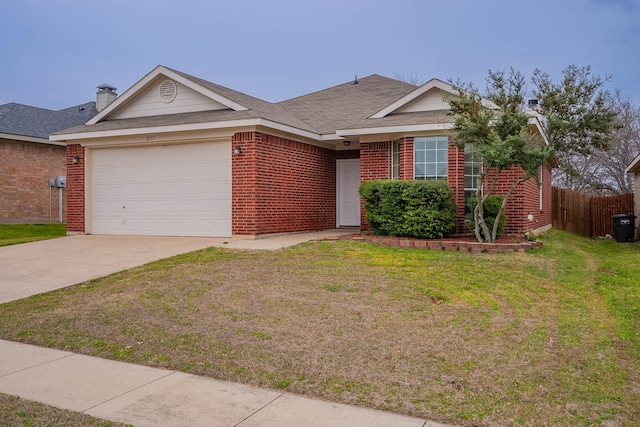 ranch-style home with fence, concrete driveway, a front yard, a garage, and brick siding