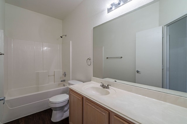 full bath with vanity, wood finished floors, toilet, and tub / shower combination