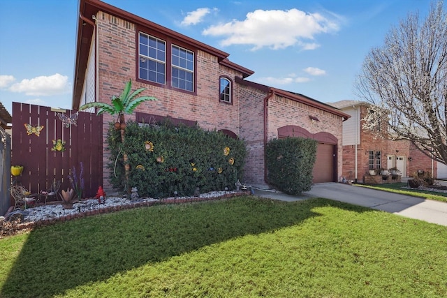 view of front of house with a front yard, a garage, brick siding, and driveway