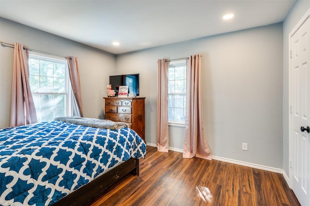 bedroom featuring recessed lighting, baseboards, and dark wood finished floors