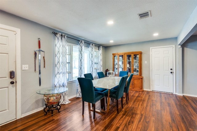 dining space with dark wood finished floors, recessed lighting, baseboards, and visible vents