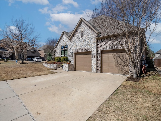 view of front of house with stone siding and concrete driveway