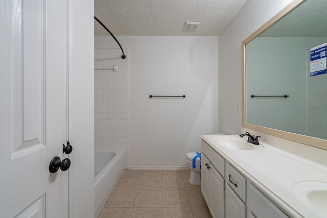 full bathroom with visible vents, double vanity, a sink, a textured ceiling, and toilet