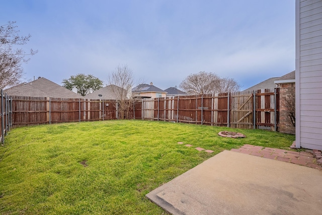 view of yard featuring a patio and a fenced backyard