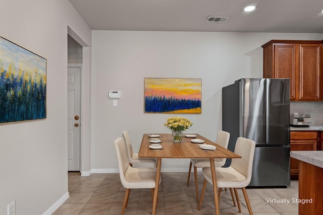 dining room featuring recessed lighting, light tile patterned flooring, baseboards, and visible vents