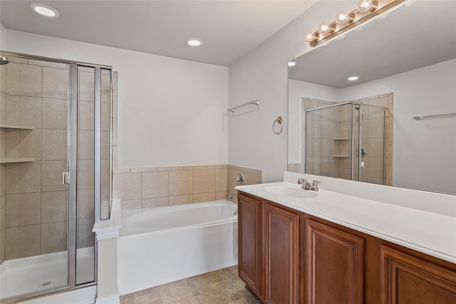 full bathroom featuring recessed lighting, a garden tub, a stall shower, and vanity