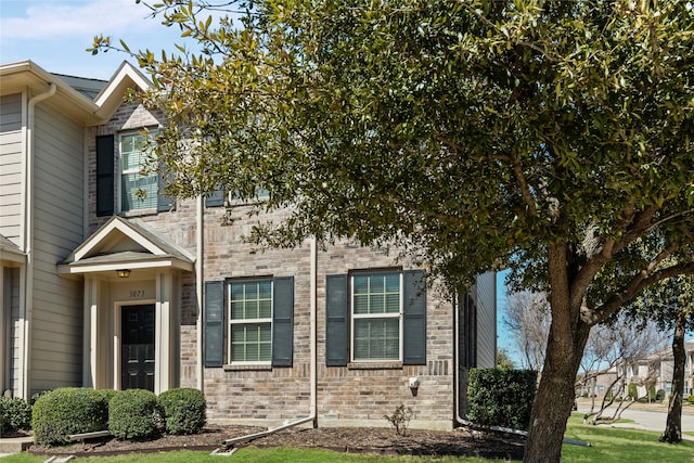 view of front of property with brick siding