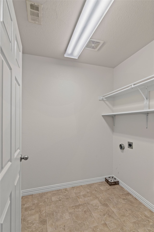 laundry room with visible vents, baseboards, hookup for an electric dryer, and laundry area