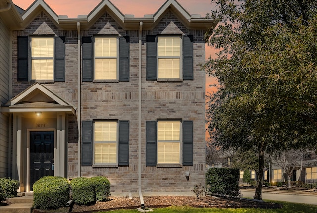 multi unit property featuring brick siding