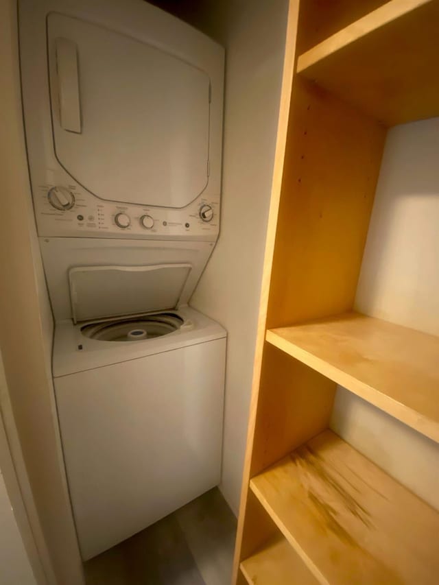 laundry room featuring laundry area and stacked washing maching and dryer