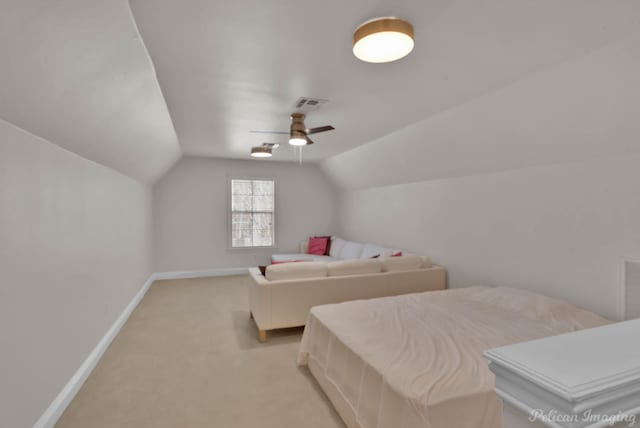 bedroom with visible vents, a ceiling fan, baseboards, light colored carpet, and vaulted ceiling