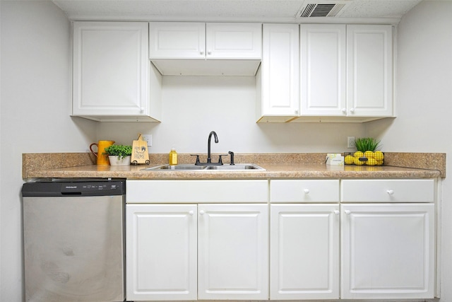 5831 Harvest Hill Rd Unit 1069, Dallas, TX 75230 - kitchen with stainless steel dishwasher, a sink, and white cabinetry