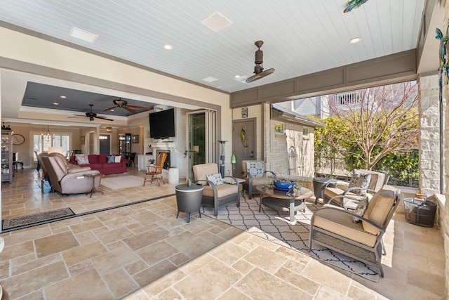 view of patio featuring an outdoor living space and ceiling fan