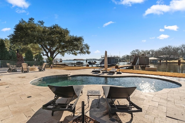 view of swimming pool featuring a fenced in pool, a patio, and fence