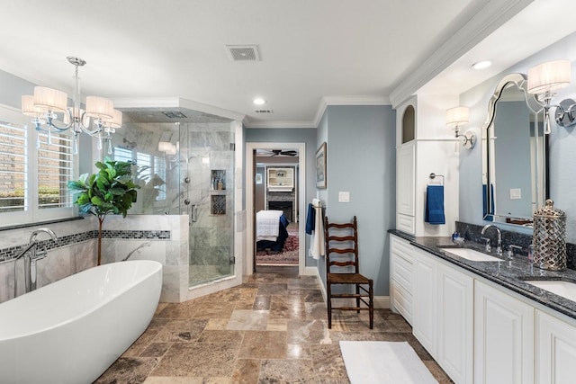 full bathroom featuring visible vents, ornamental molding, a stall shower, ensuite bath, and a sink