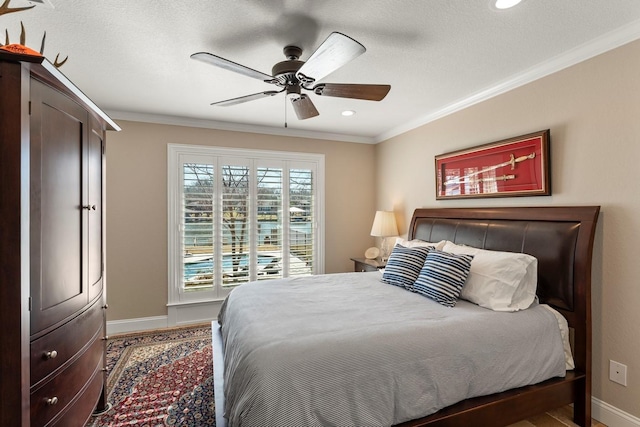 bedroom featuring crown molding, recessed lighting, baseboards, and ceiling fan