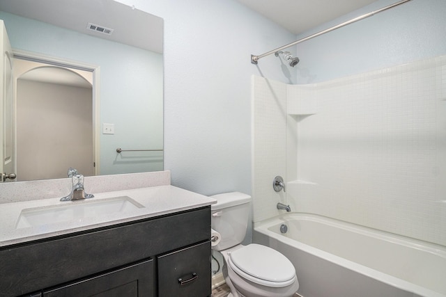 bathroom featuring tub / shower combination, visible vents, toilet, and vanity