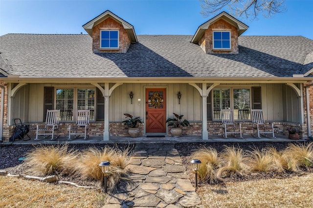 view of front of property featuring board and batten siding, a porch, and a shingled roof