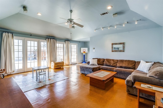 living room featuring visible vents, a ceiling fan, track lighting, and vaulted ceiling